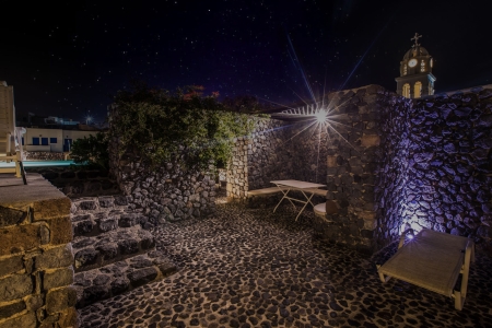 Mansion Kyani heritage villa courtyard and dining table in Megalochori Santorini