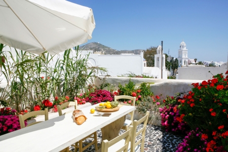 Kitchen courtyard with dining table of Mansion sophia heritage villa in Megalochori Santorini