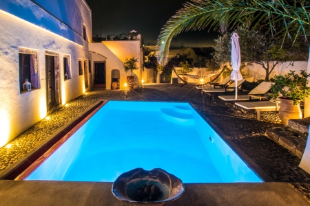 Mansion sophia heritage villa exterior pool view by night in Megalochori Santorini