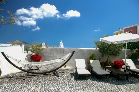 Courtyard with hammock of Mansion sophia heritage villa in Megalochori Santorini