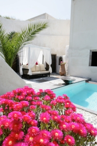 Mansion Sophia heritage villa pool with beautiful flowers in Megalochori Santorini