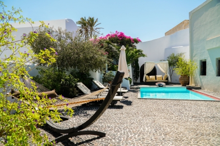 Courtyard and pool of Mansion sophia heritage villa in Megalochori Santorini