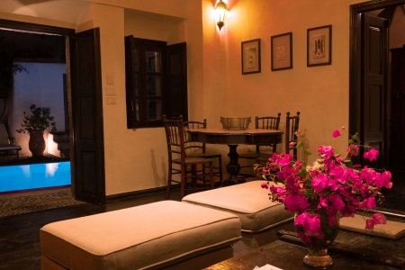 Living room by night of Mansion sophia heritage villa in Megalochori Santorini with pool view
