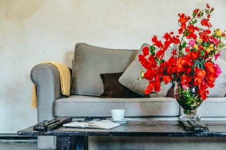 Living room detail with flowers of Mansion sophia heritage villa in Megalochori Santorini