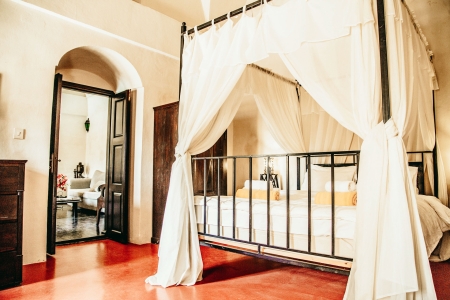 Master bedroom king size bed of Mansion sophia heritage villa in Megalochori Santorini